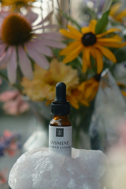 flower essence in rose quartz crystal with wildflowers and 5D clear quartz